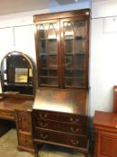 A mahogany bureau bookcase