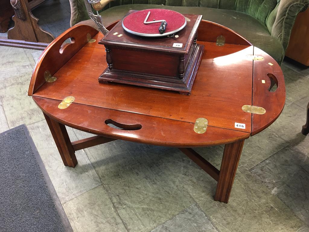 A reproduction mahogany butlers tray and stand