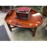 A reproduction mahogany butlers tray and stand