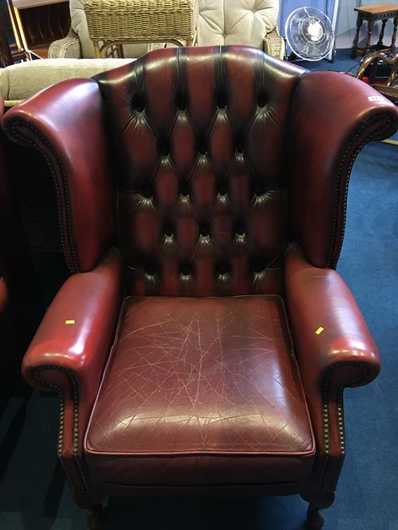 An oxblood Chesterfield high back armchair