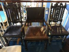 A pair of carved oak chairs and a carver chair