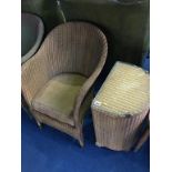 A Lloyd Loom chair and linen basket