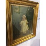 A gilt framed portrait of a child situated between two fences