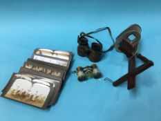 A stereoscope viewer and cards etc.