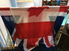 A Canadian flag, 265cm wide x 135cm long and a Union Jack, 180cm wide x 90cm long