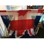 A Canadian flag, 265cm wide x 135cm long and a Union Jack, 180cm wide x 90cm long