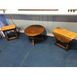 An oak stool, a circular table and an oak drop flap table