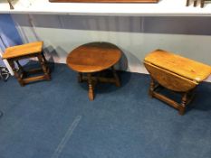 An oak stool, a circular table and an oak drop flap table