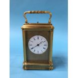 A brass carriage clock with strike action.