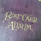 A postcard album and contents, mostly continental