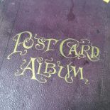 A postcard album and contents, mostly continental
