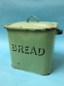 A green enamel bread bin