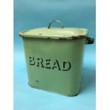 A green enamel bread bin