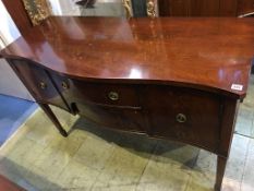 A reproduction mahogany serpentine fronted sideboard