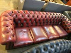 An oxblood Chesterfield four seater settee