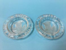 A pair of glass 'Players Navy Cut' ashtrays
