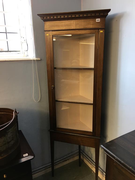 An Edwardian standing corner cabinet