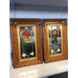A pair of oak framed Victorian painted glass mirrors