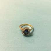 An 18ct (750) gold, diamond and sapphire ring, weight 4 grams, size 'L'