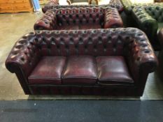 A Chesterfield oxblood three seater settee