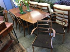 A teak McIntosh extending dining table and a set of six chairs