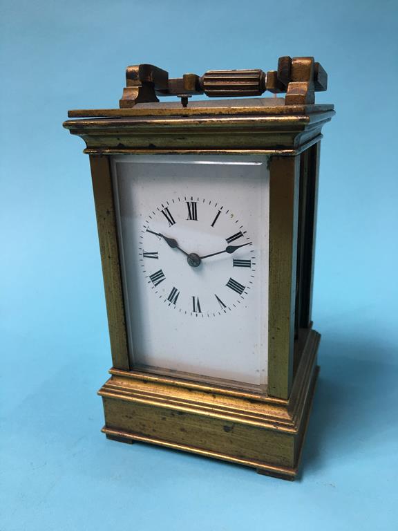 A brass chiming carriage clock, approx. 14.5cm tall