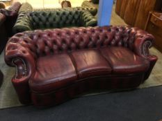 A Chesterfield oxblood three seater settee