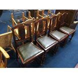 Four oak dining chairs