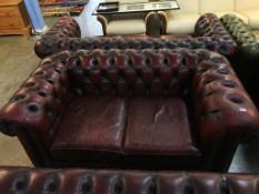 A Chesterfield oxblood two seater settee