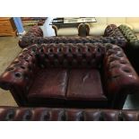 A Chesterfield oxblood two seater settee