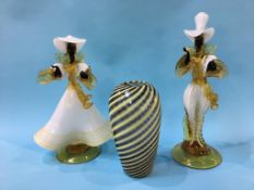 A pair of Murano amber and white glass figures of two ladies and a tapering glass vase, with