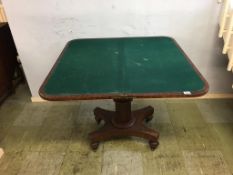 A 19th century mahogany fold over card table