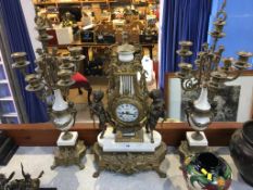 A modern three piece clock garniture