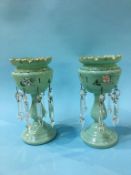 A small pair of Victorian pale green lustres, 26cm high