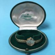 A Ladies 9ct gold Rolex cocktail wristwatch, with original box, total weight 21.3 grams