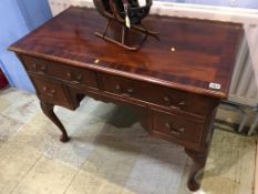 A reproduction mahogany writing desk