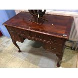 A reproduction mahogany writing desk