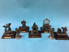 Five Myth and Magic figures and a pair of candlesticks