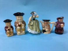 A Royal Doulton figure and four Toby jugs