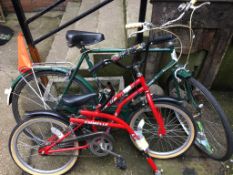 A vintage Puch bike and an Emmelle bike with tandem attachment