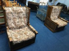 A pair of oak linenfold armchairs (for reupholstery)