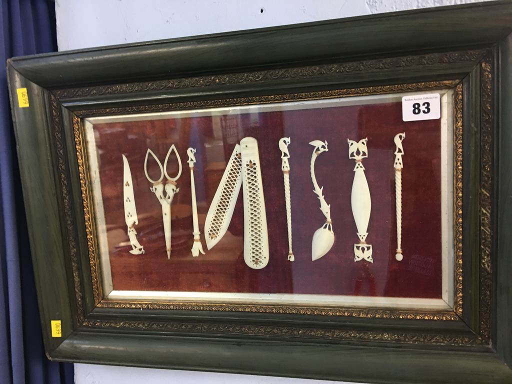 A collection of framed ivory items, to include a penknife and scissors etc.