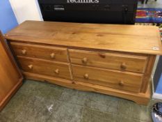 A low pine chest of drawers