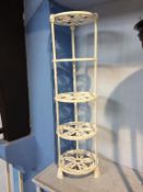 A metal work five tier circular stand