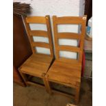 A pair of oak chairs