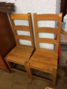 A pair of oak chairs