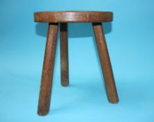 A Mouseman style oak stool, the top carved with a Cat's head (no Mouse)