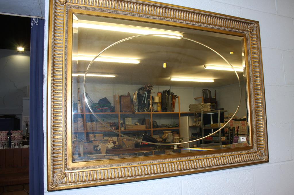 A gilt framed mirror