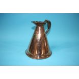 A copper 'Half Gallon' measuring jug