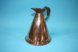 A copper 'Half Gallon' measuring jug